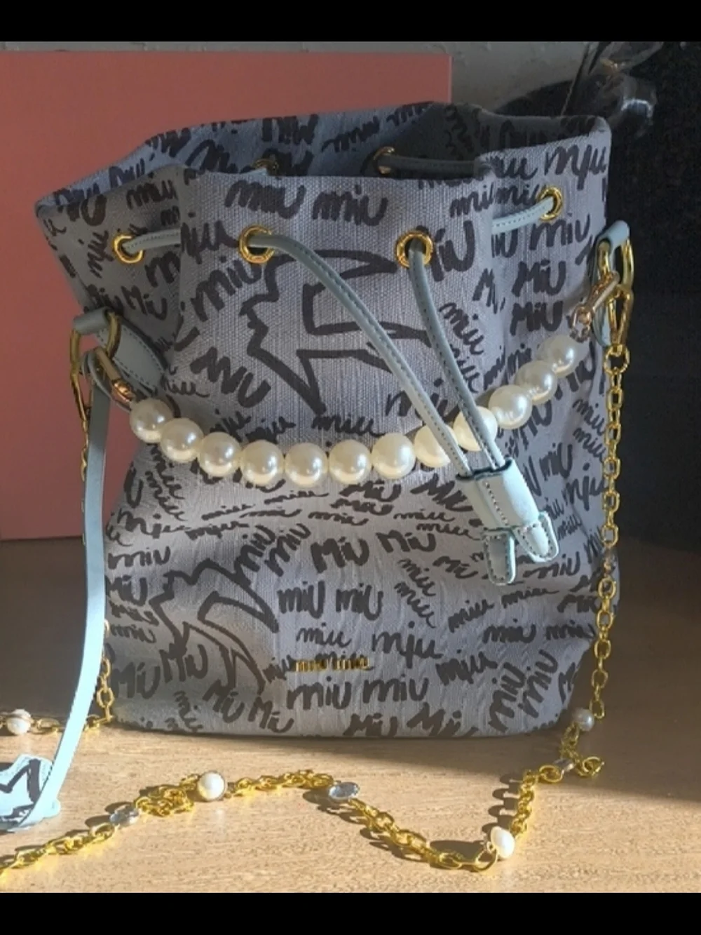 Miu Miu Gray Logo Drawstring Mini Bag with Light Blue Accents and Pearl Handle - Picture 3 of 4